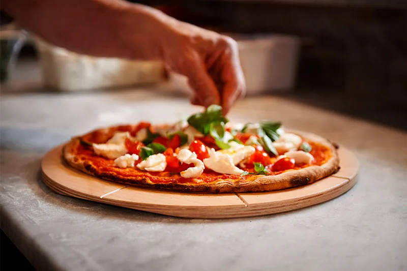 Linea Dori 16" x 16" Beech Wood Round Pizza Cutting Board, 8 Carved Slices, 0.5" Thick